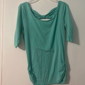 Size small teal long sleeve with bow in back style